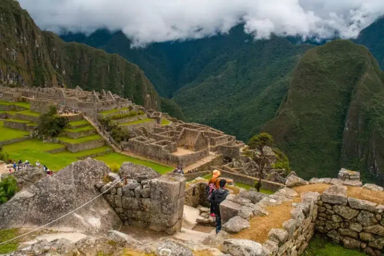 Expansive view of Machu Picchu's main complex and agricultural terraces, a magnificent reward for classic inca trail hikers - Peru Hikers.