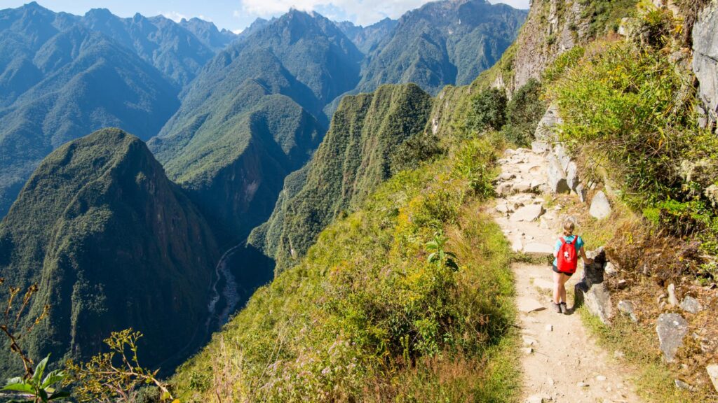 Hiker on the Short Inca Trail during the dry season, showcasing the clear skies that make this the best time to trek - Peru Hikers