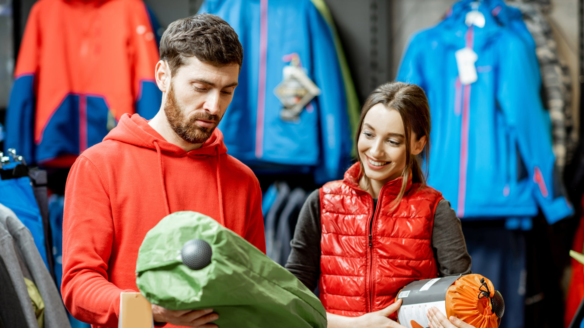 A hiker efficiently packing and organizing the essential trekking gear in a duffel bag, highlighting smart trekking gear rental cusco.